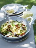Cheese salad with green asparagus and dried tomatoes