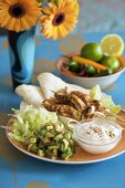 Chicken skewers, tortillas, guacamole and sour cream (Mexico)