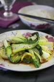 Fried pak choi with side dish of rice (Asia)