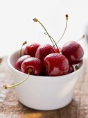 Fresh cherries in dish