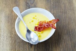 Cream of sweetcorn soup with slices of fried ham