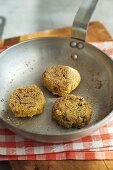 Risotto patties in frying pan