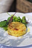 Potato gratin with salad leaves