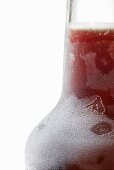 Amaro herbal liqueur in icy bottle (detail)