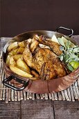 Roast chicken with lemon and Greek potatoes