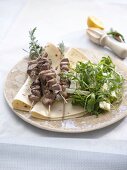 Lamb kebabs with fennel and rocket salad