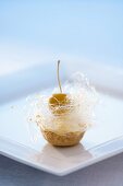 Small apple cake with vanilla crème fraîche and spun sugar