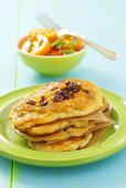 Pancakes with dried tomatoes, tomato salad