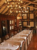 Festively set dining table in wooden house