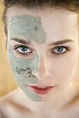 A woman with an aloe vera face mask