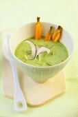 Spinach soup with grated coconut and carrots