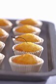 Ready baked cherry muffins on a baking tray