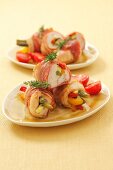 Bacon-wrapped turkey rolls with vegetable filling