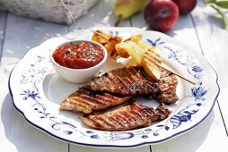 Barbecued pork chops with tomato sauce