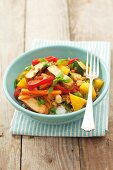 Pork with rice, pineapple, carrots, peppers and courgettes