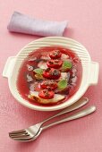 Chicken breast with strawberries and raisins in red wine jelly