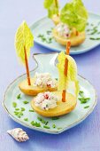 Potato boats with soft cheese, radishes and cucumber