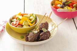 Mince skewers with salad