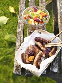 Barbecued sausages with ratatouille salad