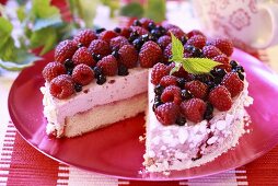 Raspberry cream cake with meringue crumbs