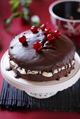 Chocolate cake with cherries on top