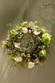 Flower wreath hanging by a wall