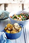 Barbecued vegetables (corn on the cob, potatoes) and salad