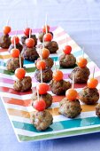 Meatballs and tomatoes on cocktail sticks