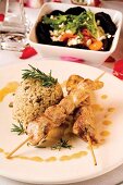 Chicken kebabs with mushroom risotto and beetroot salad