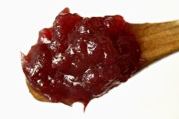 Redcurrant jelly on a wooden spoon