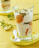 Pistachio yoghurt cream with grapefruit segments in glass
