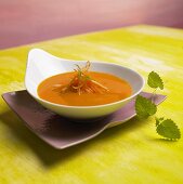 Carrot and lime soup in a soup plate