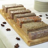 A selection of terrines and jellied meats on a buffet