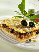 Onion pie with olives and capers