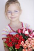 Girl holding a bouquet of roses