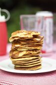 Corn pancakes in a pile on a plate