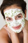 Woman with quark and cress face mask