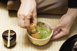 Japanese tea master at tea ceremony