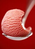 Strawberry ice cream on a spoon