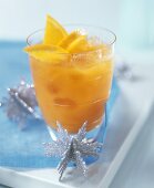 Orange drink with ice cubes