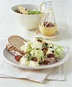 Cheese salad with grapes and onions