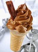 Cone of soft chocolate ice cream with a chocolate flake