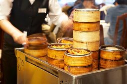 Dim sum in bamboo steamers on a trolley in a Chinese restaurant