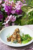 Chicken kebabs with ginger and salad