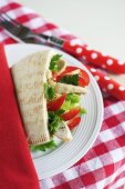 A pitta bread stuffed with chicken and pepper