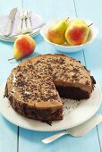 Chocolate cake with pears and chocolate mousse, sliced
