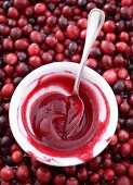Home-made cranberry sauce in dish on cranberries