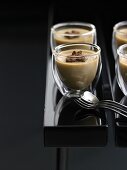 Coffee panna cotta in four glasses