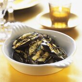 Grilled aubergine slices with herbs and garlic