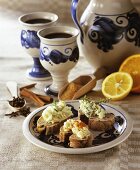 Mulled wine in jug & cups with wholemeal bread & herb butter
